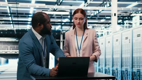 Server hub engineering team using laptop to monitor power consumption Stock Footage 330209659