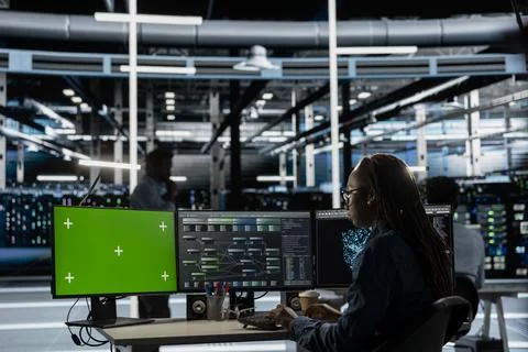 Server hub expert using AI programming language on chroma key computer Stock Photos