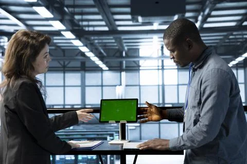 Server hub IT professionals talking, using chroma key device Stock Photos