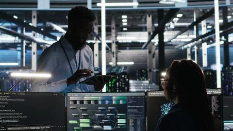 Server hub manager talking with programmer using node tree software Stock Photos