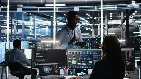 Server hub manager talking with programmer using node tree software Stock Photos