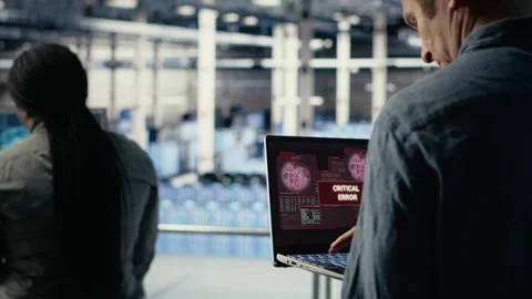 Server hub programmer alerted by warning message on laptop about bugs Stock Footage 314685958