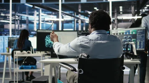 Server hub programmer with paraplegia uses AI machine learning node tree tool Video stock 307034668