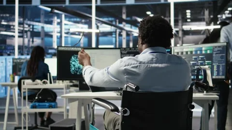 Server hub programmer with paraplegia uses AI machine learning node tree tool Stock Footage 309124077