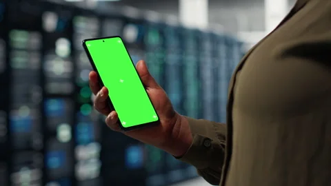 Server hub software developer uses green screen smartphone Stock Footage 317124204