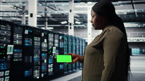 Server hub software developer uses green screen smartphone Stock Footage 317124823