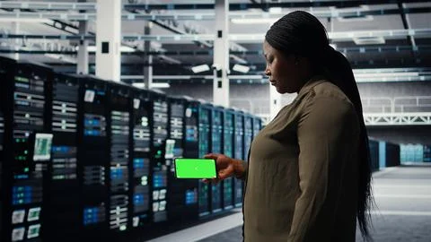 Server hub software developer uses green screen smartphone Stock Photos