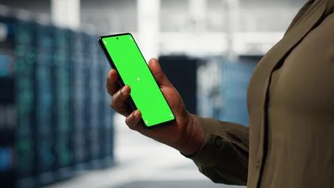Server hub software developer uses green screen smartphone Stock Photos