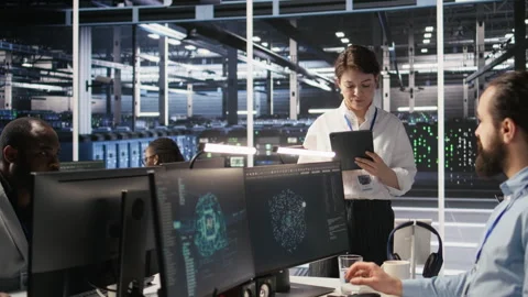 Server hub supervisor oversees data scientist examining neural network algorithm Video stock 309776070