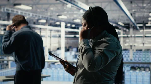 Server hub tech support expert guides clients set up secure company data backups Stock Footage 314803606