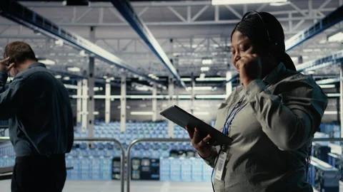 Server hub tech support expert guides clients set up secure company data backups Stock Footage 314804925