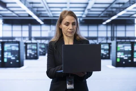 Server hub worker identifying and resolving technical issues Stock Photos