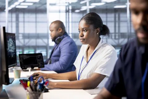 Server hub workers designing and deploying software architectures Stock Photos