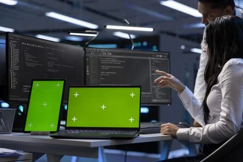 Server hub workers fixing insufficient memory errors with green screen devices Stock Photos