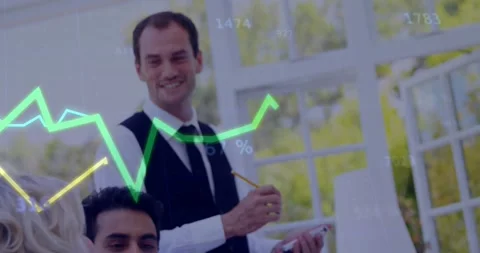 Server leaning in taking order, writing on notepad while graphs overlaying table Stock Footage 331593406