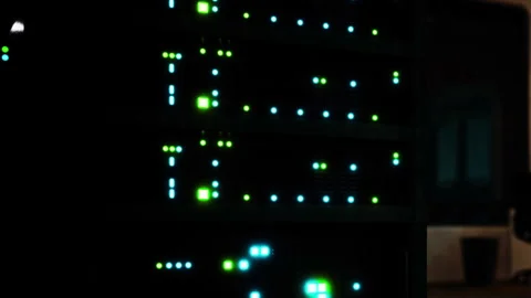 Server lights blink in a data center during evening hours Stock Footage 345007426