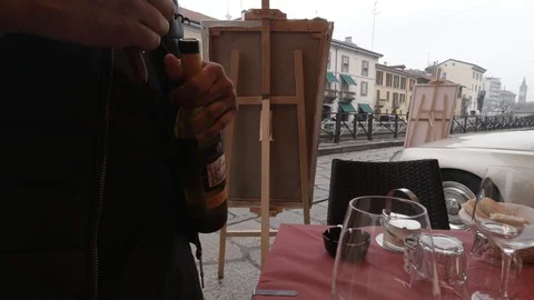 Server opening Wine bottle in Milan, Italy  Stock Footage 127329207