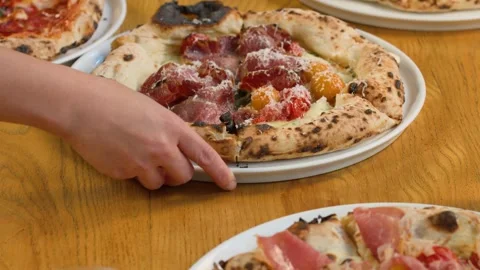 Server Placing Fresh Neapolitan Pizza on Wooden Restaurant Table Stock Footage 337757873