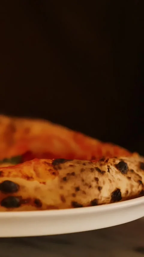 Server Placing Fresh Neapolitan Pizza on Table in Italian Restaurant Stock Footage 338377468