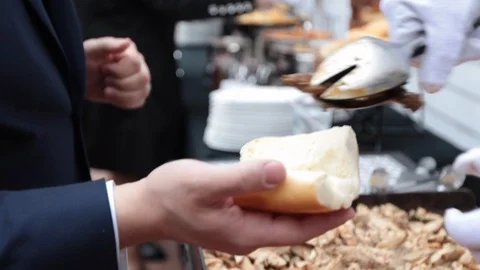 Server placing meat in bread slow motion dynamic Stock-Footage 107936425