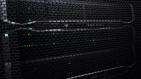 Server rack behind the metal door. Flashing green lights 動画素材 112733915