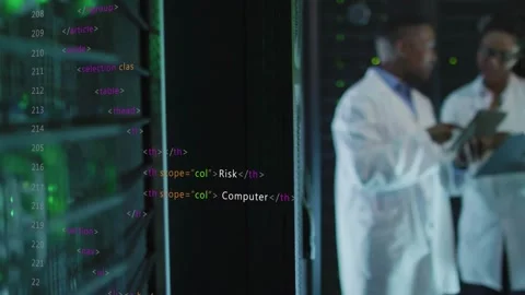 Server rack with blinking LEDs, camera widening, two techs consulting tablet, Stock Footage 332565947