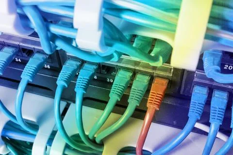 Server rack with blue and red internet patch cord cables Stock Photos
