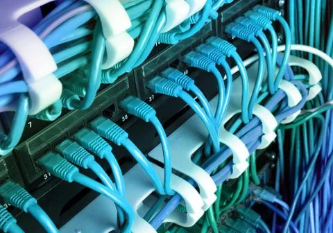 Server rack with blue internet patch cord cables Stock Photos