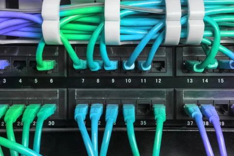 Server rack with blue internet patch cord cables Stock Photos