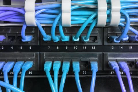 Server rack with blue internet patch cord cables Stock Photos