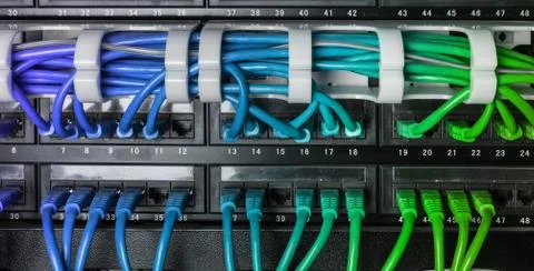 Server rack with blue internet patch cord cables Stock Photos