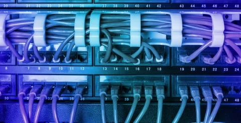 Server rack with blue internet patch cord cables Stock Photos