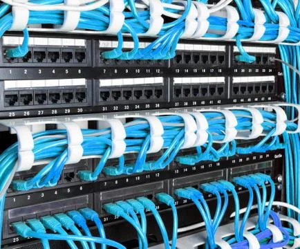 Server rack with blue internet patch cord cables Stock Photos
