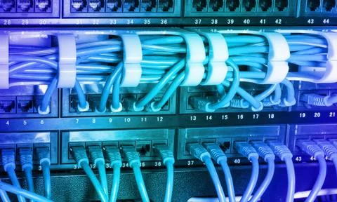 Server rack with blue internet patch cord cables Stock Photos