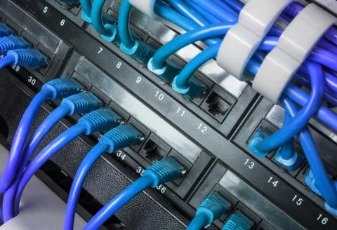 Server rack with blue internet patch cord cables Stock Photos