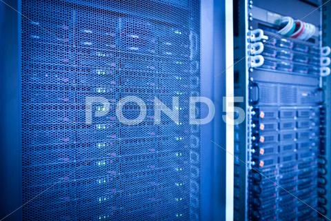 Server rack cluster in a data center (shallow DOF; color toned i Stock ...
