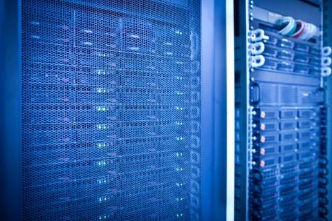 Server rack cluster in a data center (shallow DOF; color toned i Stock Photos