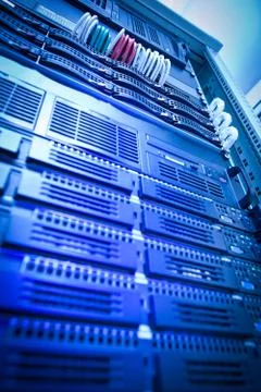 Server rack cluster in a data center (shallow DOF; color toned i Stock Photos