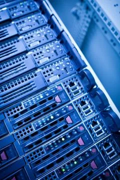 Server rack cluster in a data center (shallow DOF; color toned i Stock Photos