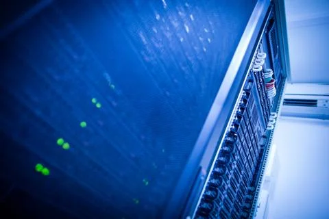 Server rack cluster in a data center (shallow DOF; color toned i Stock Photos