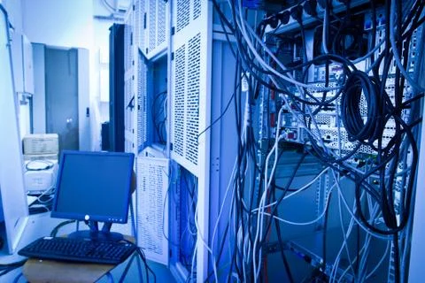 Server rack cluster in a data center (shallow DOF; color toned i Stock Photos