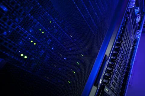 Server rack cluster in a data center (shallow DOF; color toned i Stock Photos