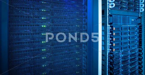 Server rack cluster in a data center (shallow DOF; color toned i Stock Photos
