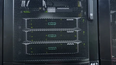 Server rack with data center hardware and green indicator lights. Stock Footage 317808067