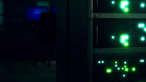 Server rack displaying green lights in a data center during night hours Stock Footage 345006170