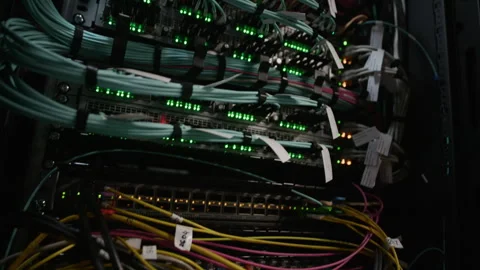 Server Rack with Fiber Optic Patch Cables in Data Center Stock Footage 330539204