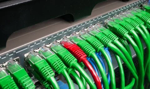 Server rack with green and red internet patch cord cables Stock Photos