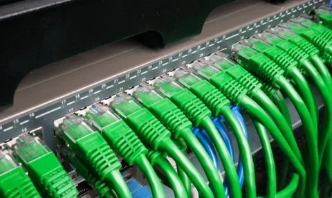 Server rack with green internet patch cord cables Stock Photos