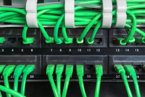Server rack with green internet patch cord cables Stock Photos
