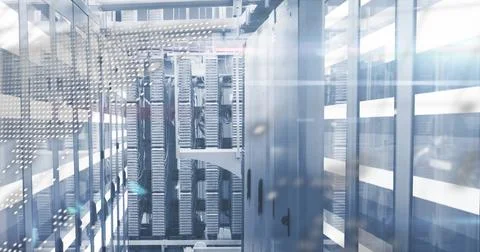 Server rack hosting network switches and patch panels in data center aisle, with Stock Photos